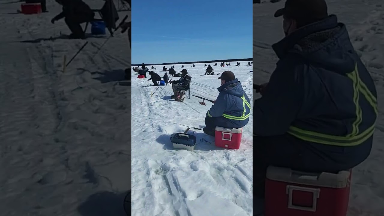 Ice Fishing on the melting  lake
