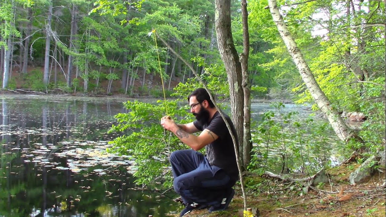 Spring pole fishing trap