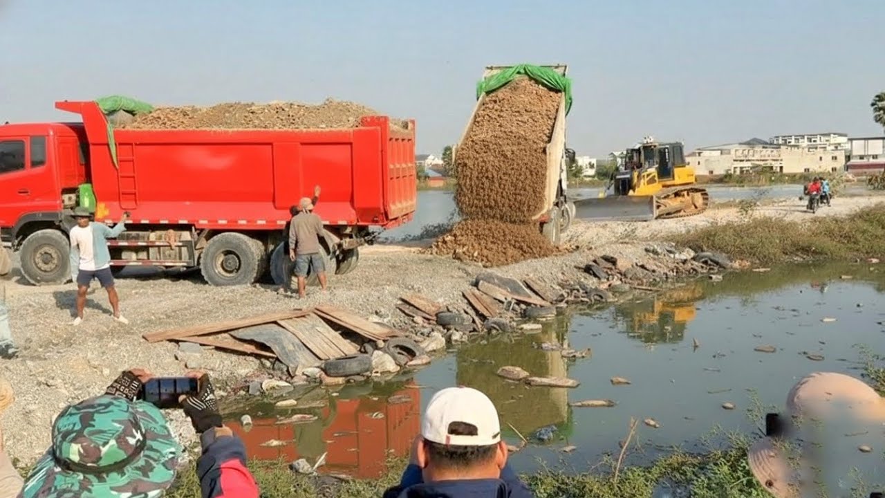 Start DONDFEND Trucks dumping stone filling delete huge pond pushing by DOZER C3 Pro
