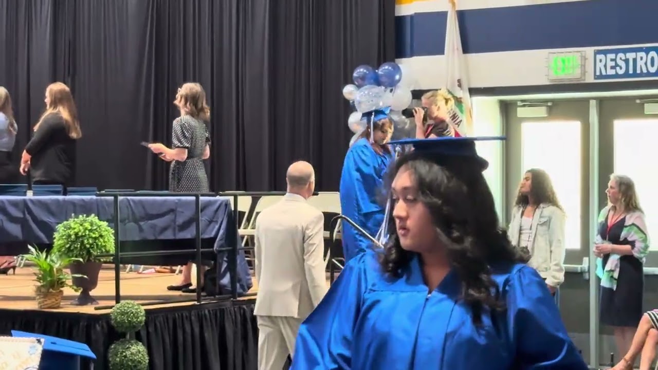 Evelyn graduates high school