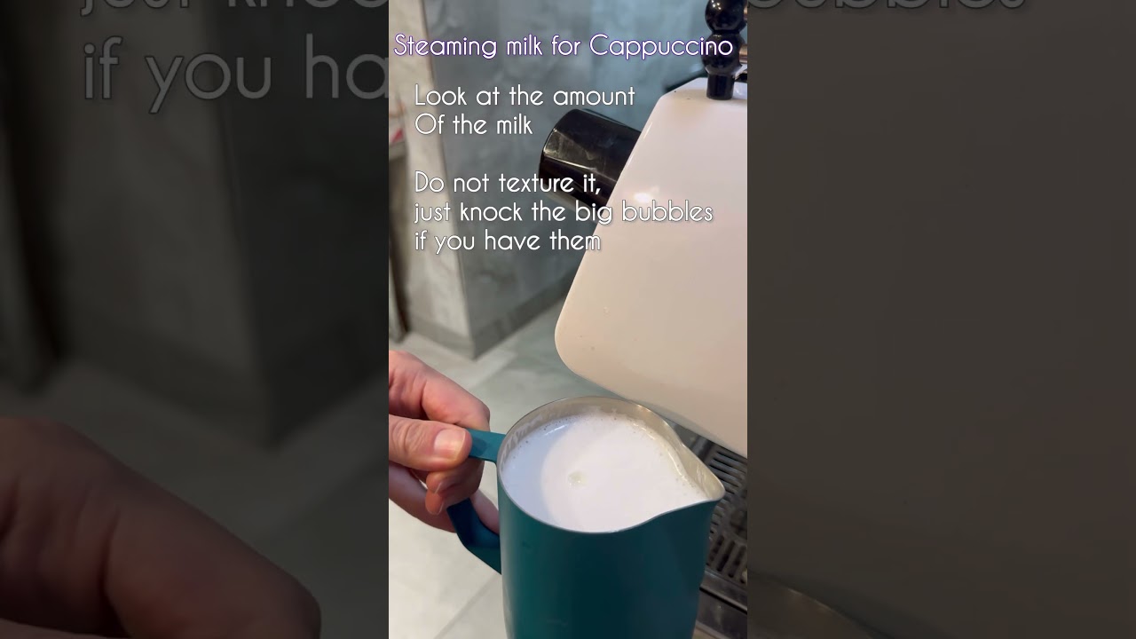 Cappuccino Steaming milk. Traditional way to steam milk for Cappuccino