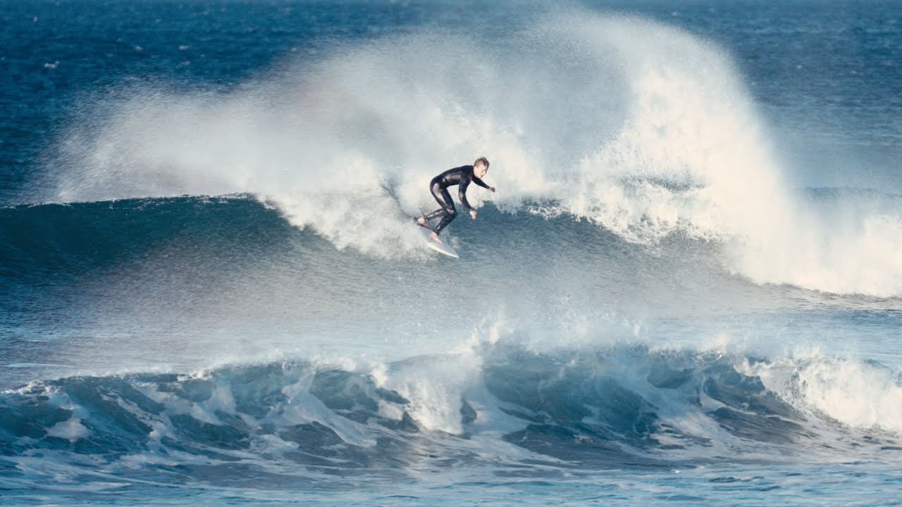 surfing a winter swell in malibu