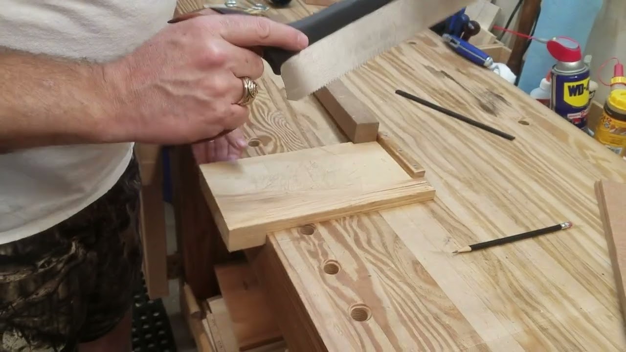 Using a bench hook to cut a board