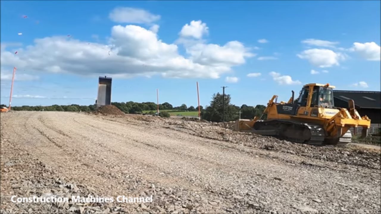 Komatsu D65 PX dozer machine working on a road construction site