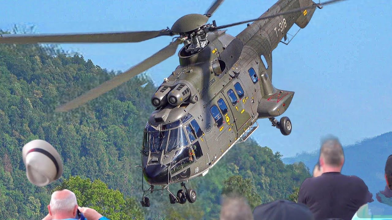 The man's hat is blown off by the strong wind of the SUPER PUMA / ZigAirMeet 23.