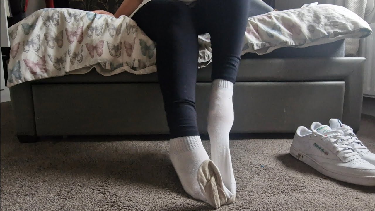 Girl pulling smelly socks off using her feet (full video available)