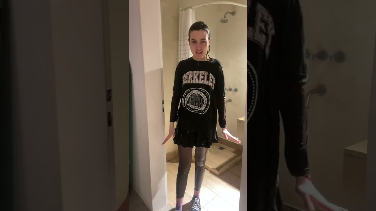 Shower fully clothed wearing two layers of shirts, skirt, tights and sneakers 