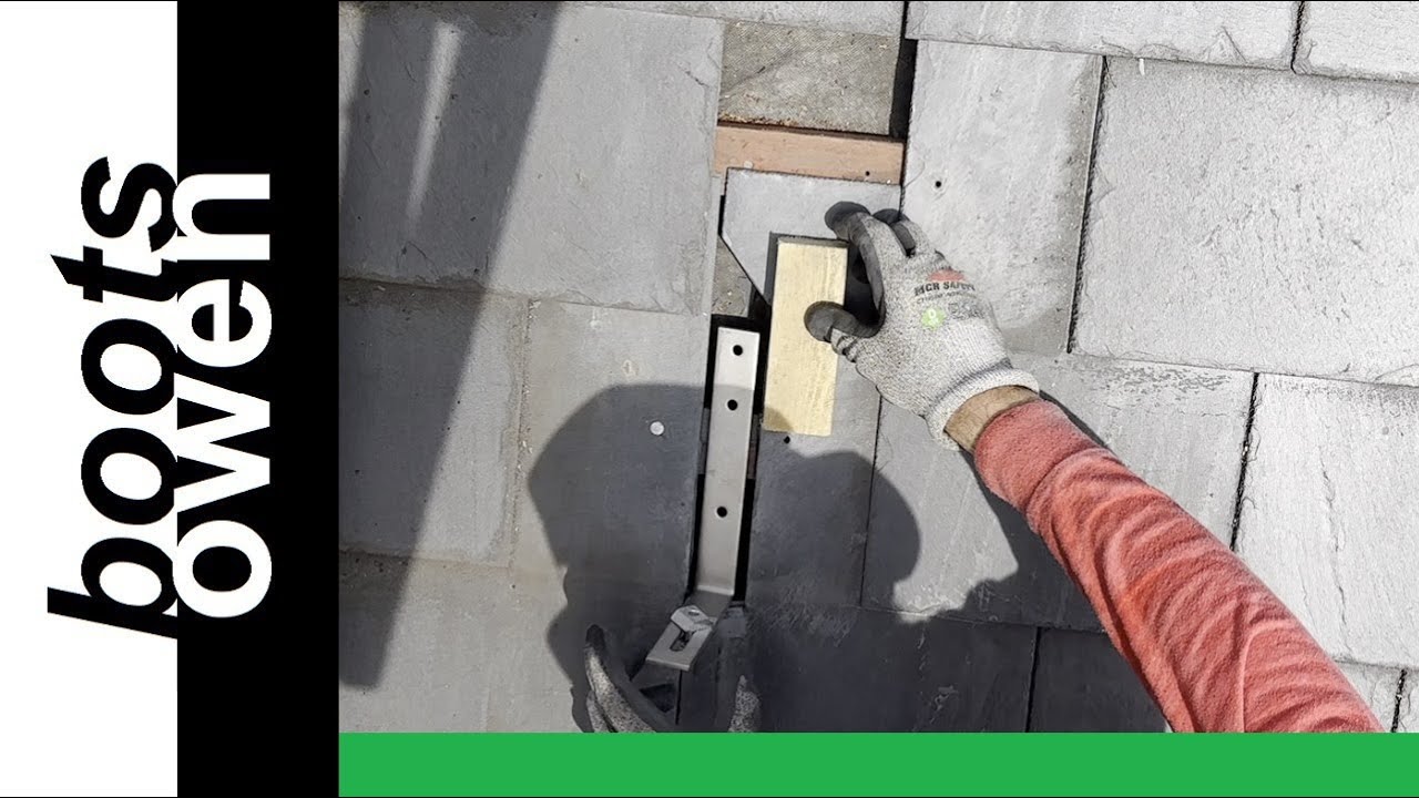 Fitting solar panel brackets to a SLATE roof