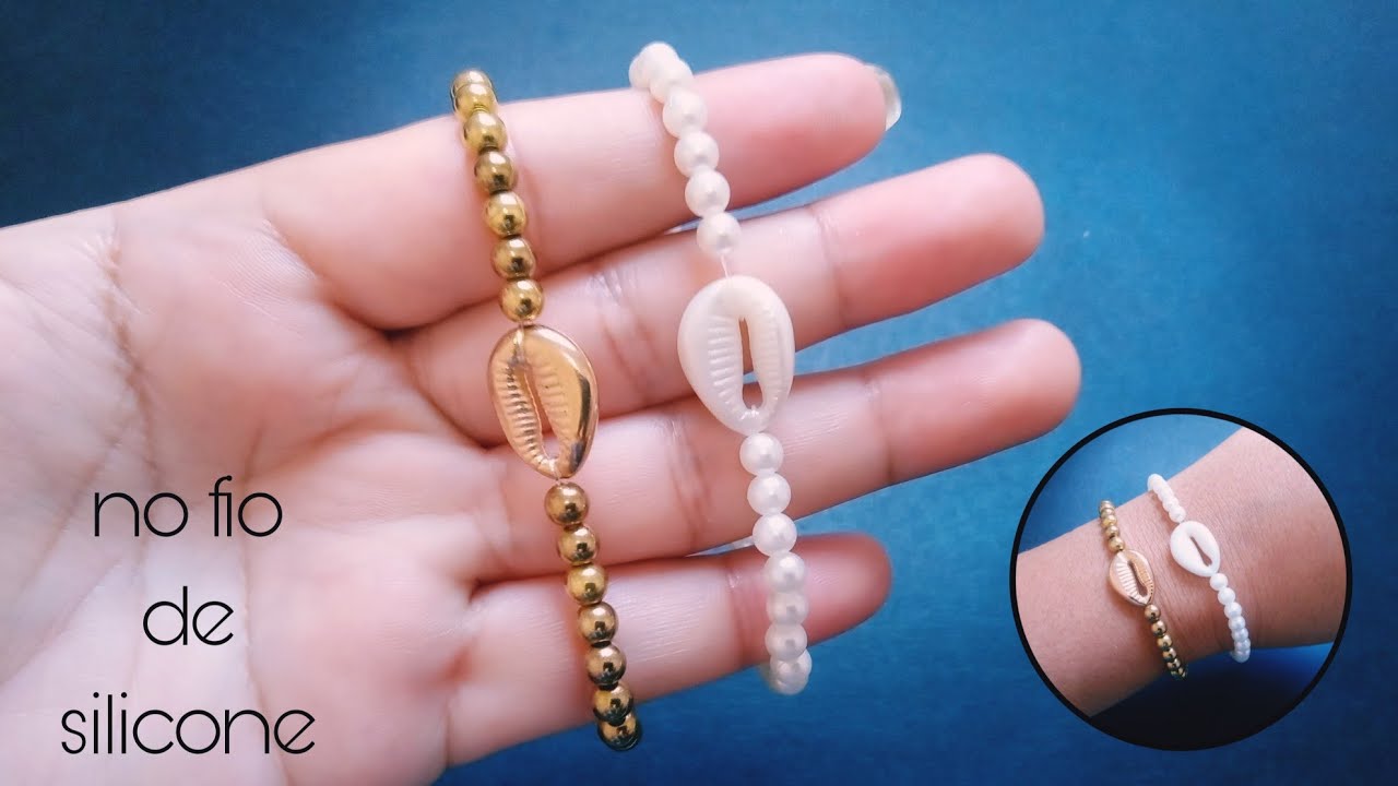 Pulseira de búzios no fio de silicone/muito fácil.