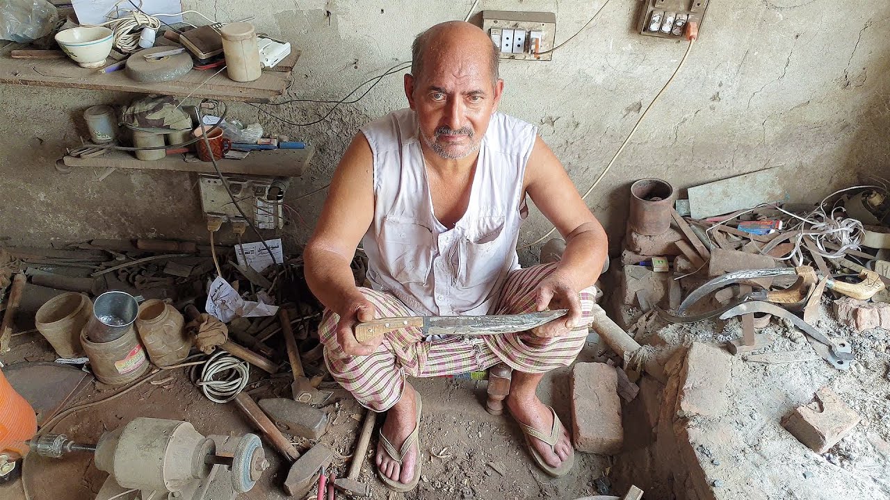 Old Man Forging Knife out of Rusty File