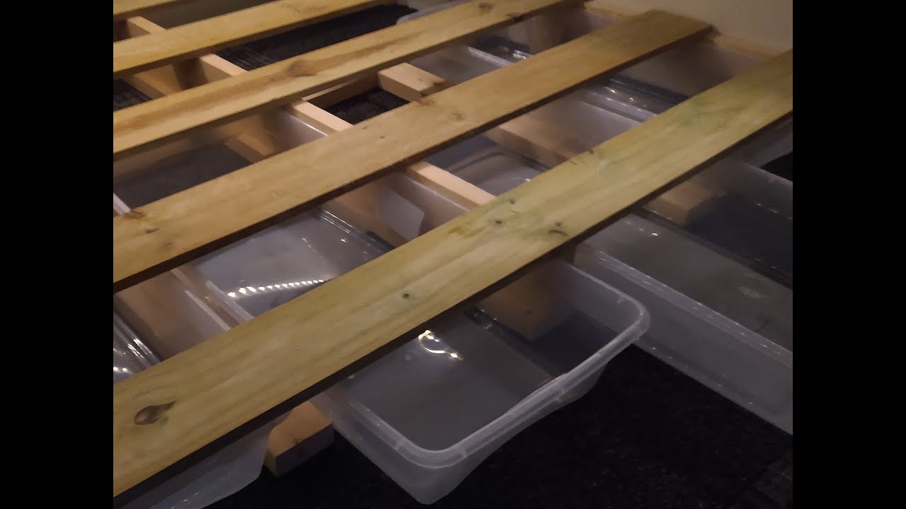Runaway Camper building a bed platform with sliding drawers for a tiny camper teardrop