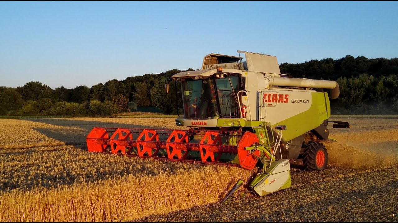 Getreideernte Claas Lexion 540 Mähdrescher Sonnenuntergang Traktoren der Landwirtschaft
