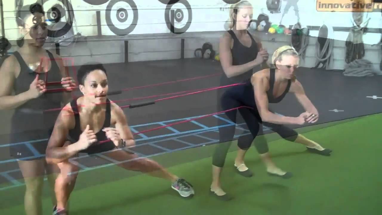 Orange County Personal Trainers Demonstrate C Band Exercises with a Partner