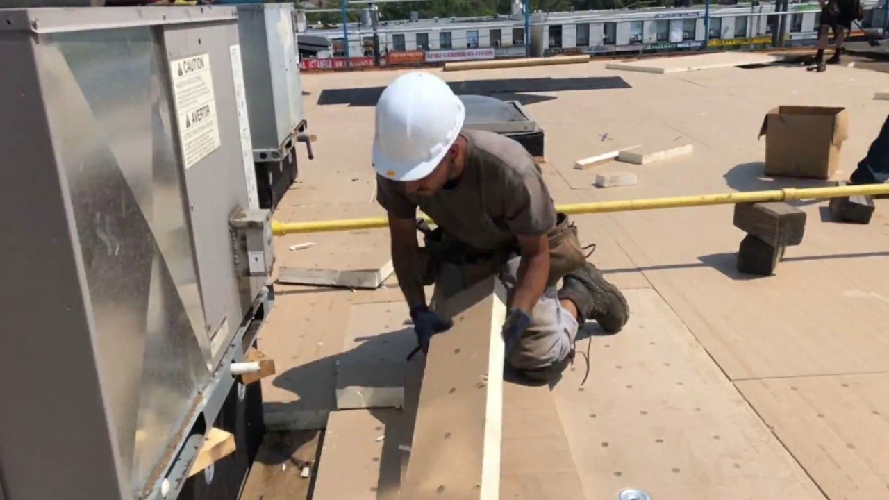 Installing Poly Iso Insulation and Sopraboard -- Soprema Commercial Roofing
