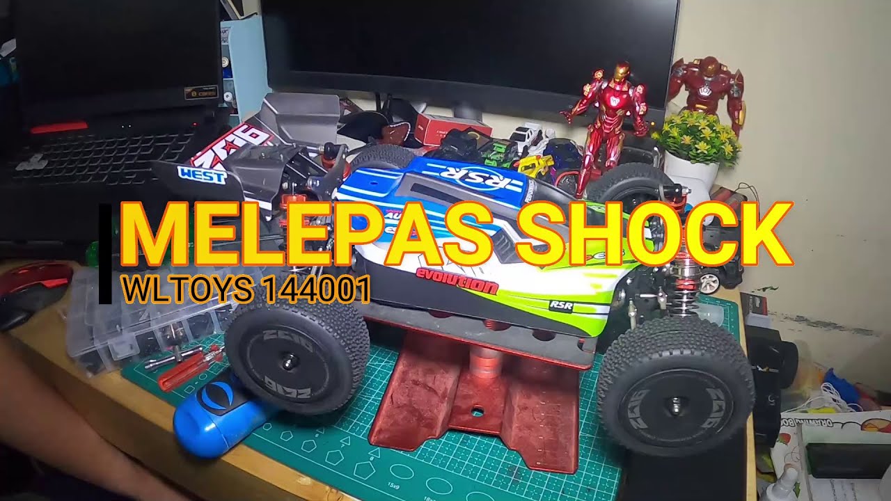 cara melepas shock rc wltoys 144001