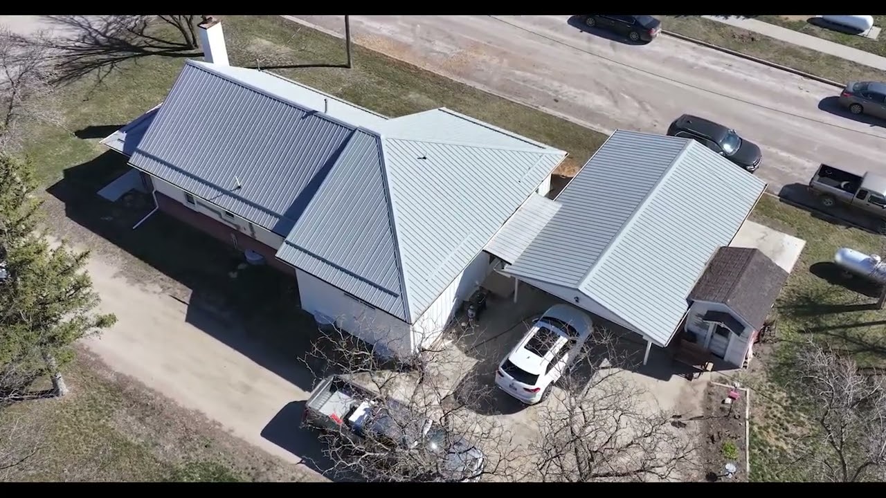 Residential Roofing & Siding Project | Light Gray Pro-Rib Metal Roof & White Board & Batten Siding