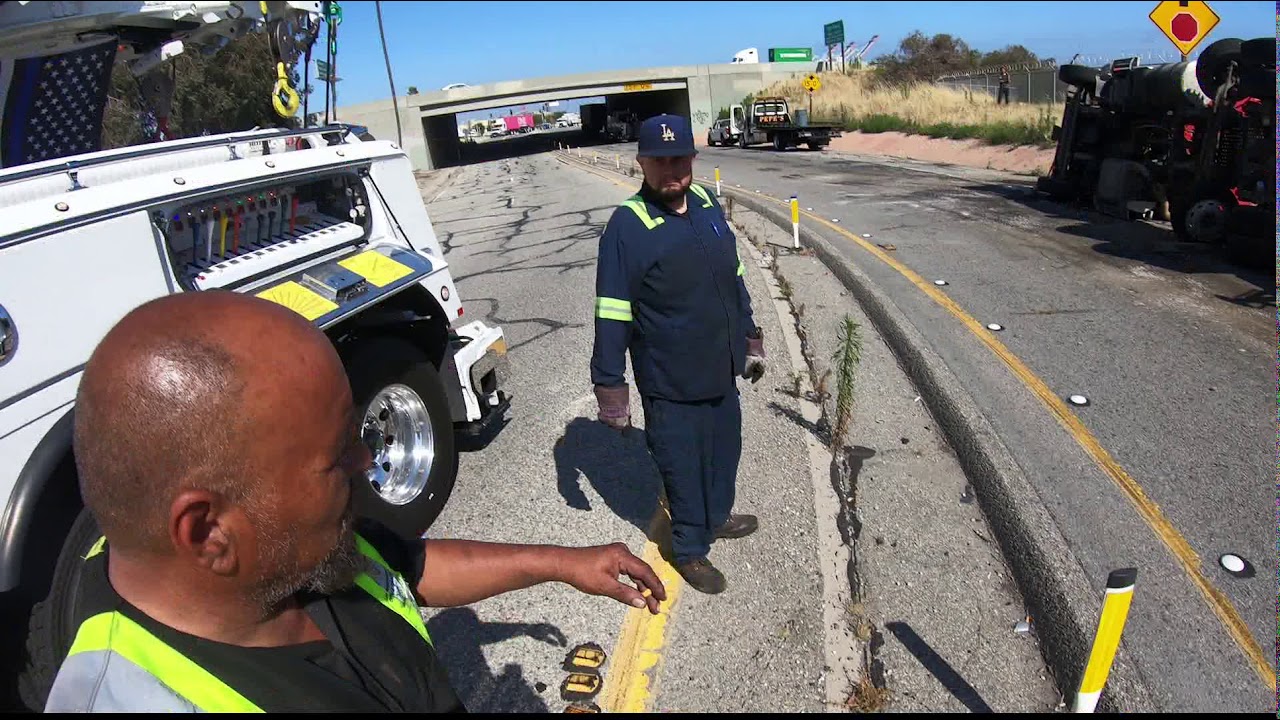 Using a 75ton rotator to upright a tractor trailer