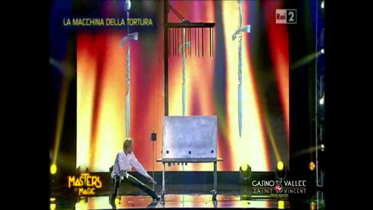Peter Marvey 's magic trick with the torture machine at Casino de la Vallée | Saint-Vincent