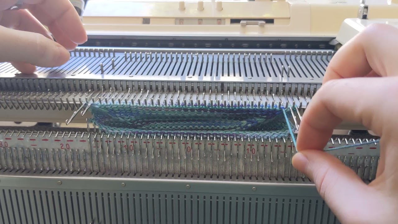Making a sock on a Brother KH-910 with ribber attachment