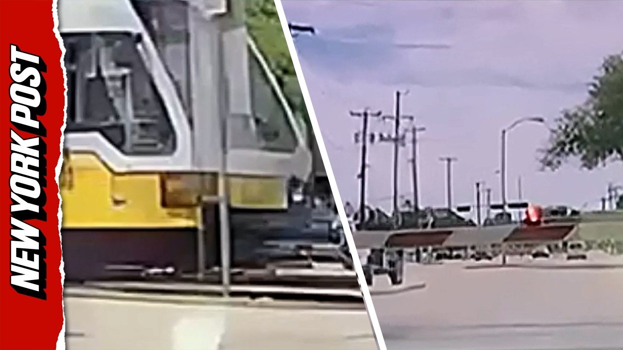 Self Driving Tesla Crashes Through Barrier Moments Before Oncoming Train