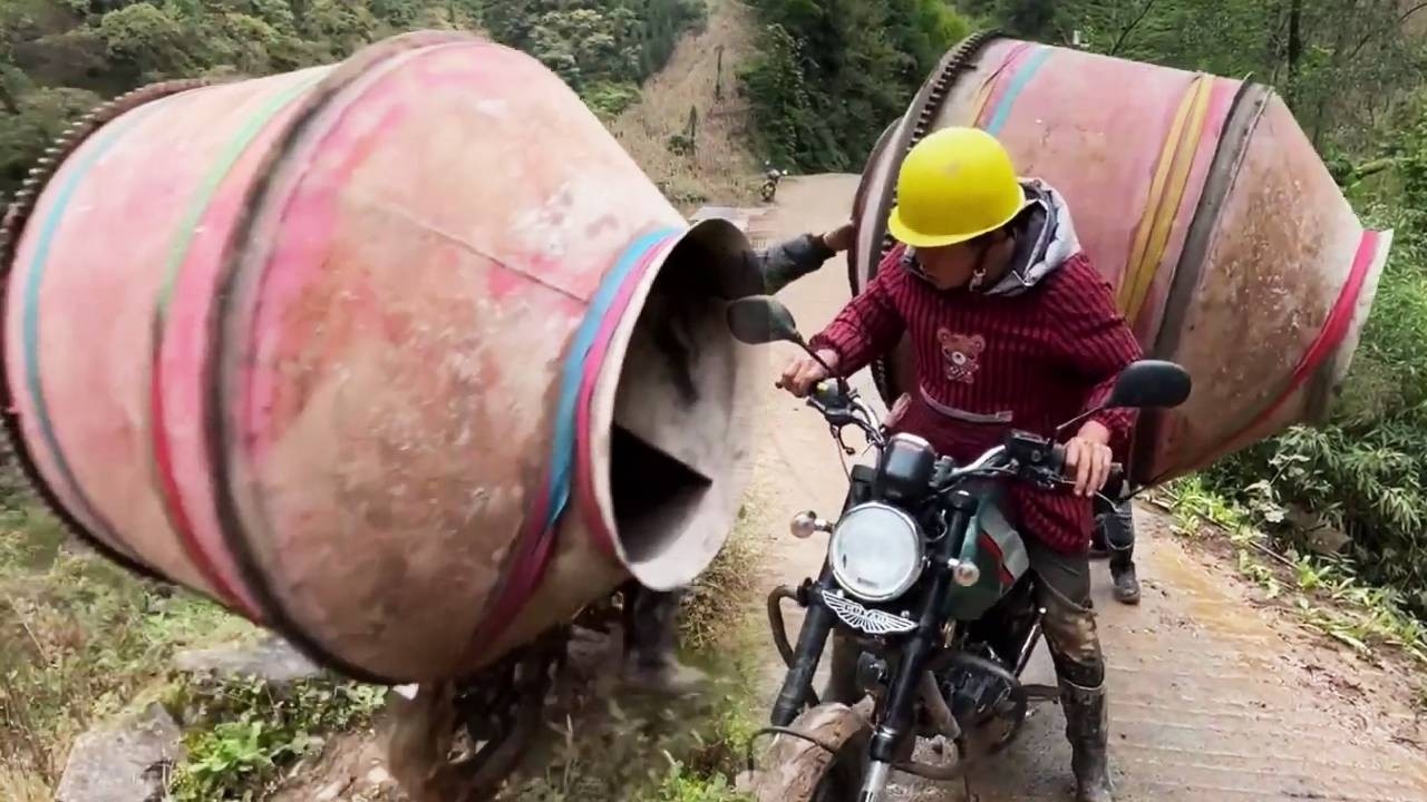 A young man on a motorcycle helped transport oversized cargo up the mountain.