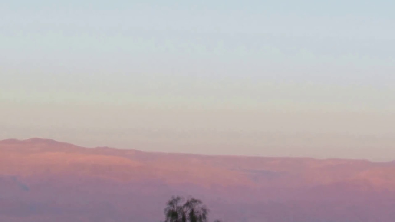 Panorama of the mountains of Jordan Rift with Dead Sea at sunset