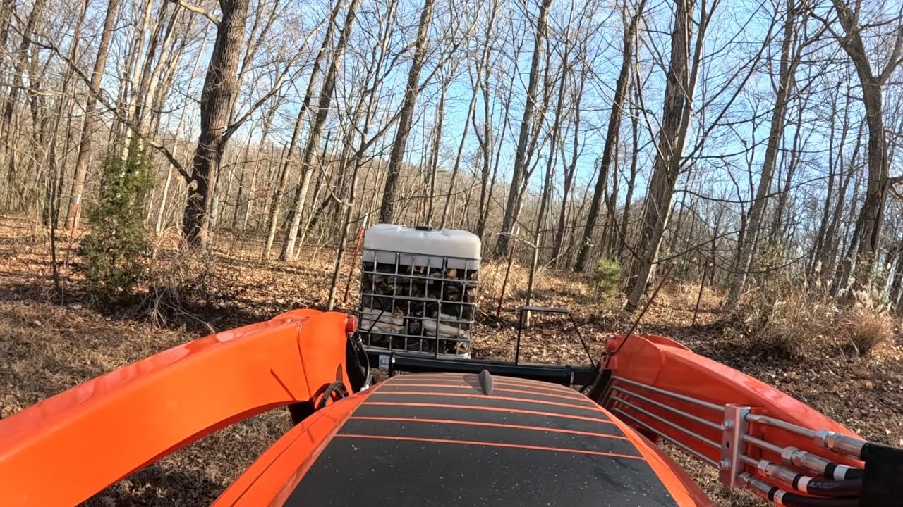 Playing with tractor & firewood. 