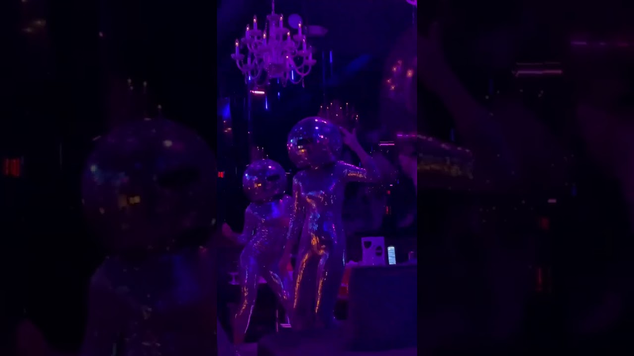 Elevate disco ball dancers