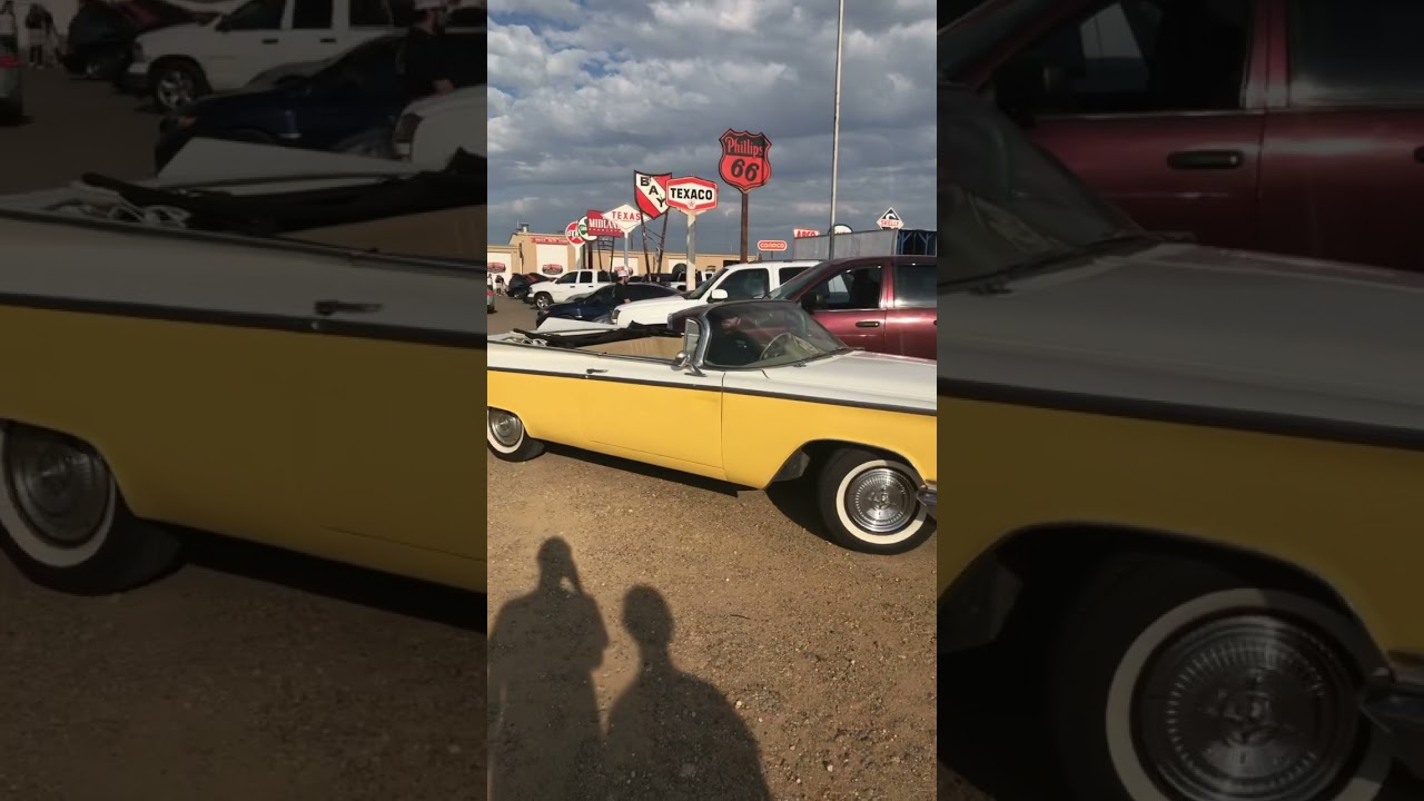 Weird looking classic car leaves cars and coffee