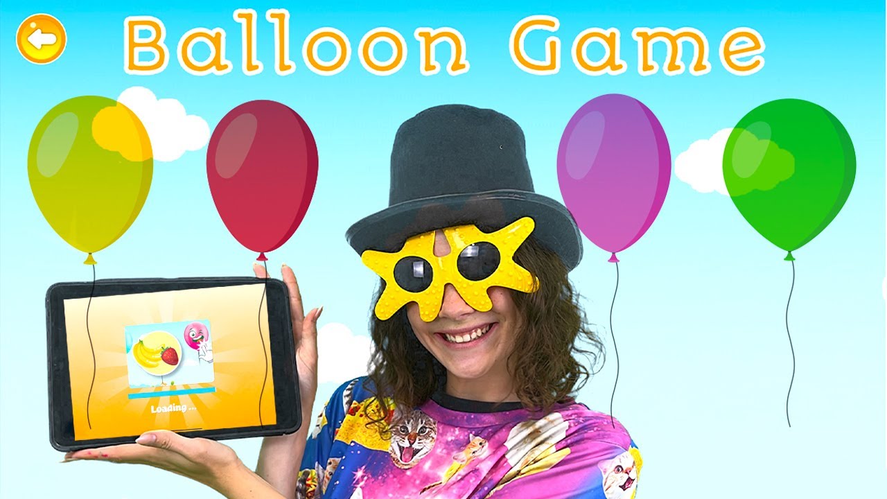 Auntie May Playing the Balloon Popping Game on TC App