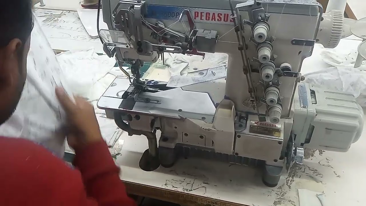 T-shirt Bottom Hem in garments by auto cutter Compressor m/c.  300 pcs capacity per hour.