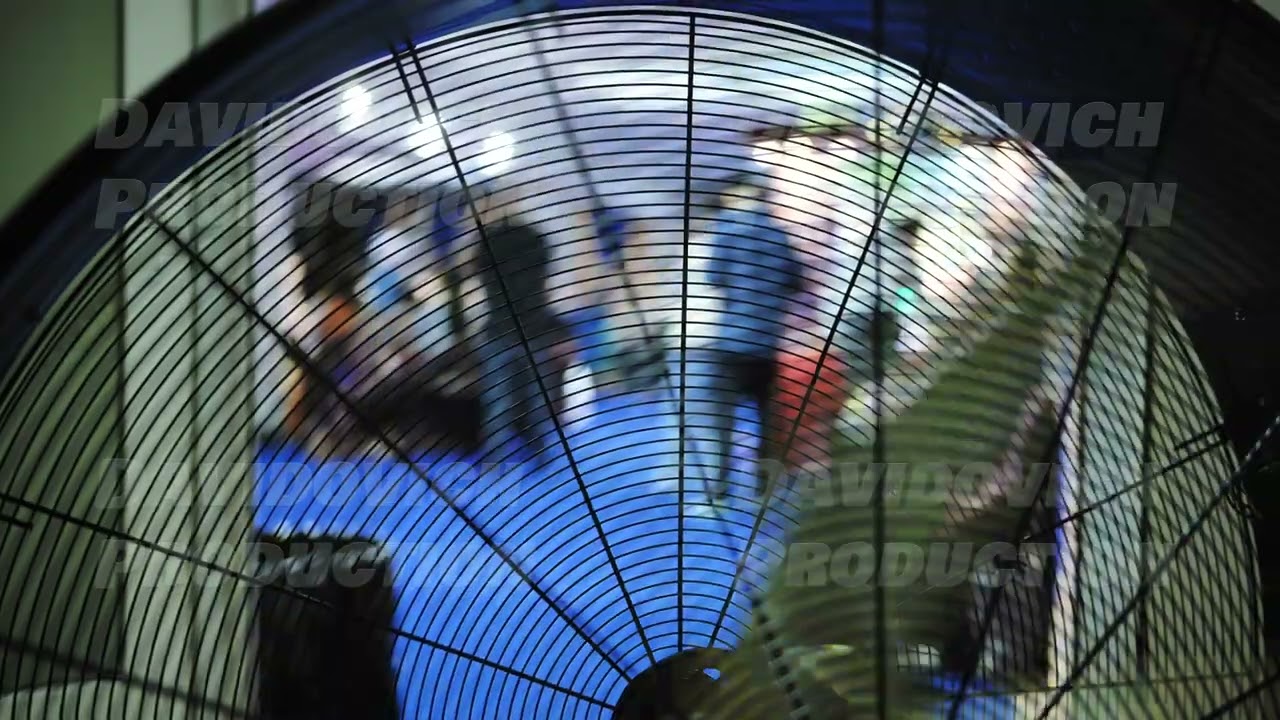 Distorted Ganesha reflecting through fan blades during Indian religious festival
