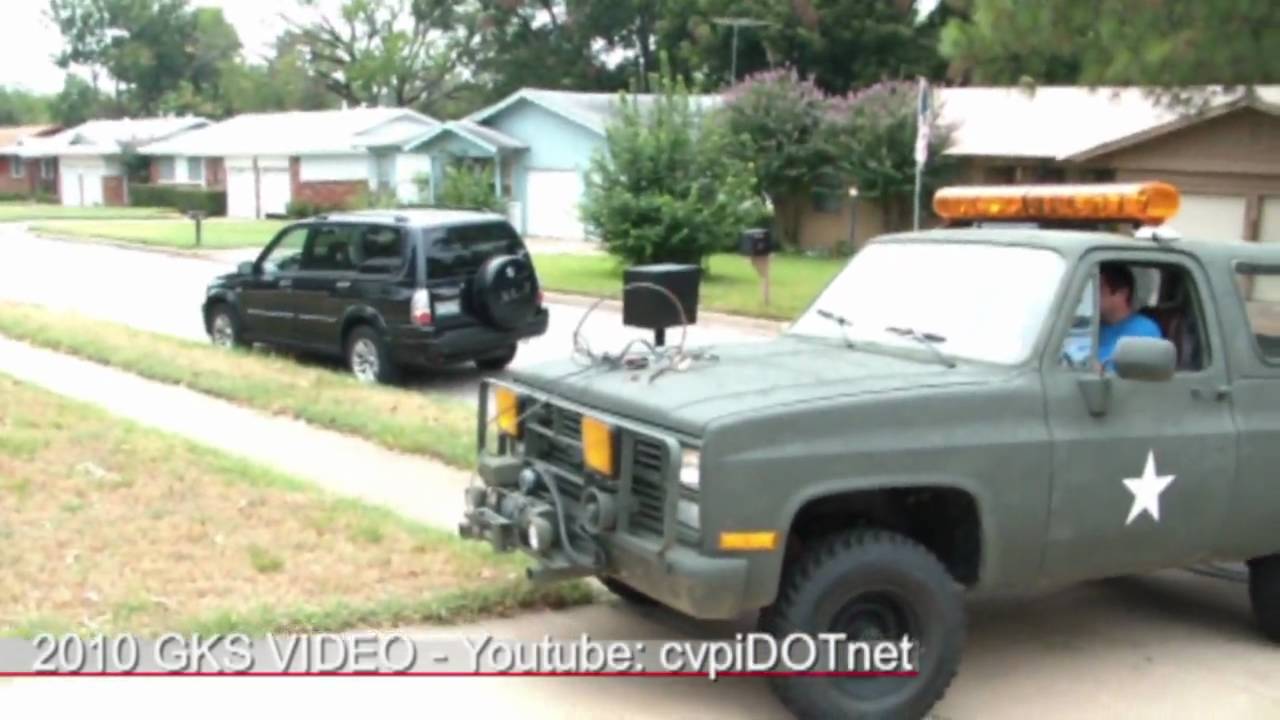 Military M1009 CUCV Blazer winch pulling out tree stump