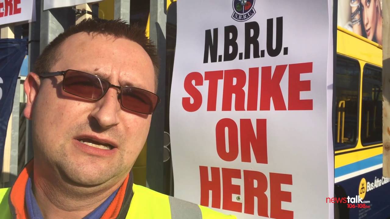 Henry McKean speaks with a Dublin Bus driver on the picket line