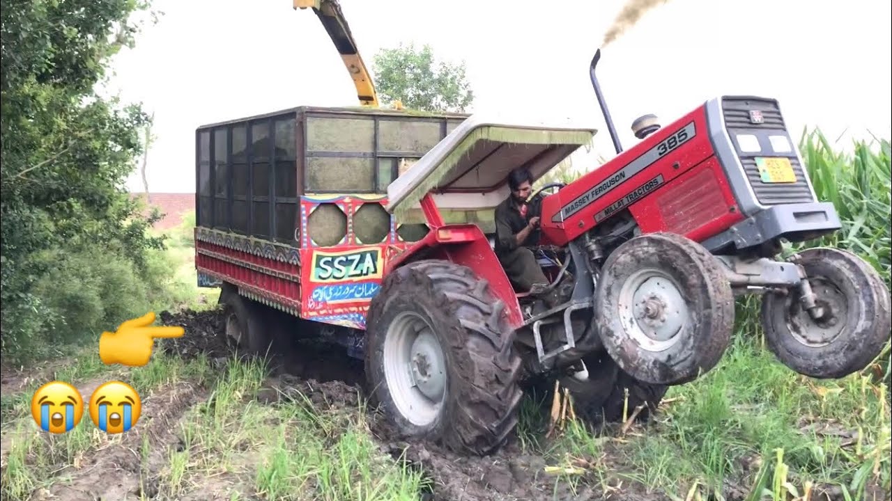 Tractor Stunt | Massey Ferguson 385 Pull Stuck Trolley From Muddy Field