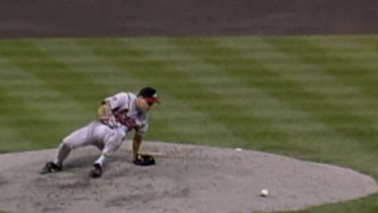 Maddux falls down, recovers to get the out