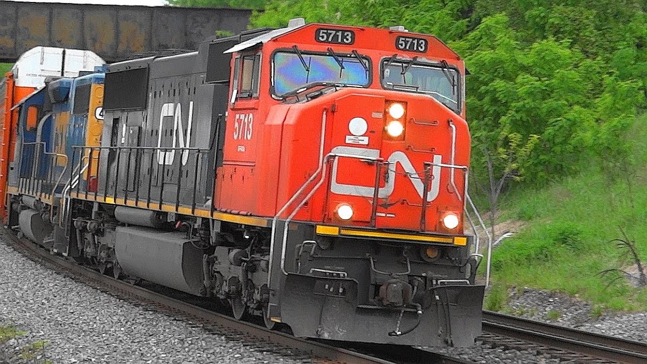 CN EMD SD75I Leading CSX Autorack Train Thru Shen