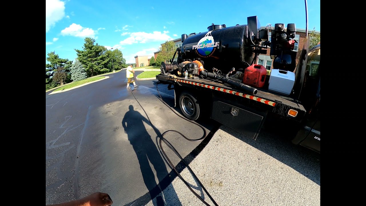 Breaking out the spraybar on a 309k sq foot sealing job at Wachusett Regional