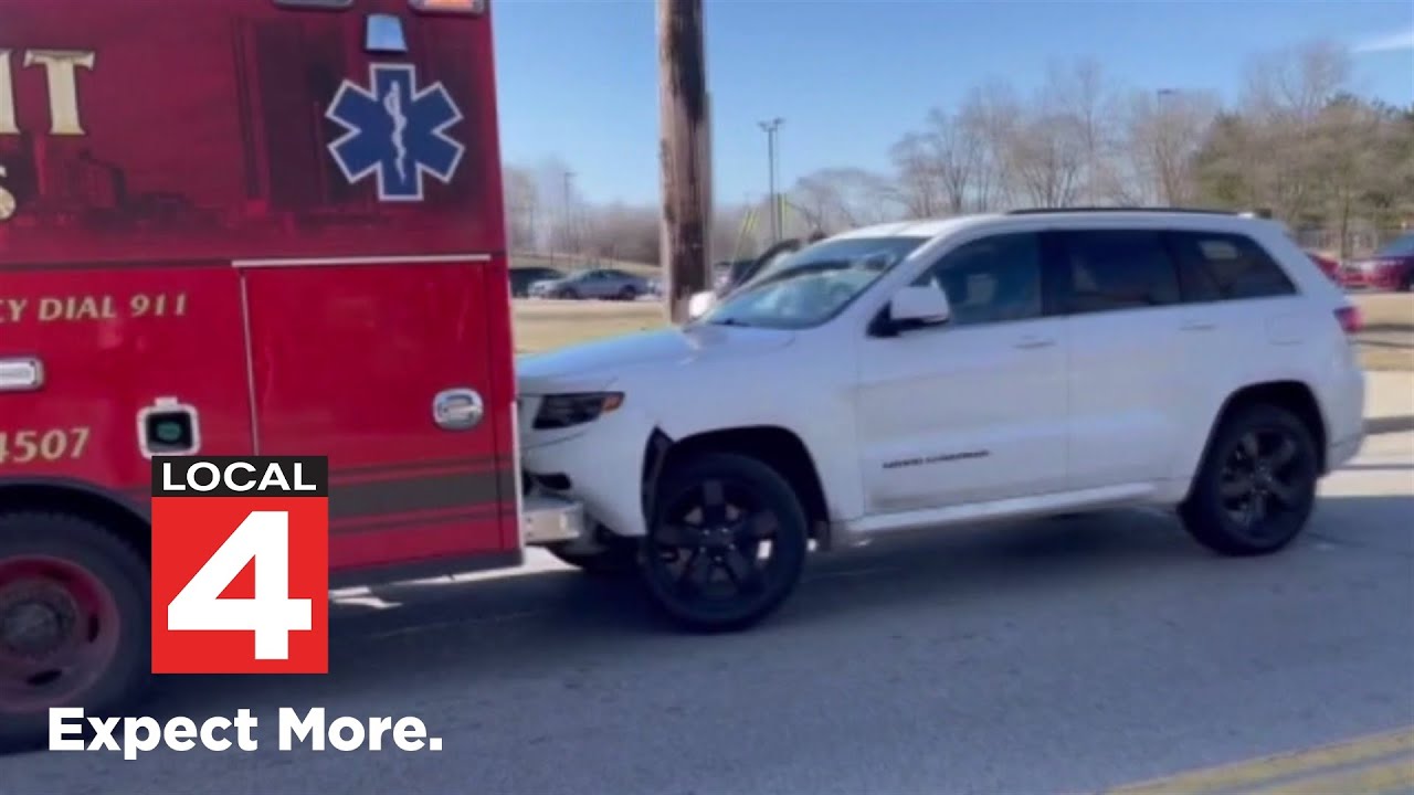 Car gets stuck to back of EMS rig after ramming it in Detroit