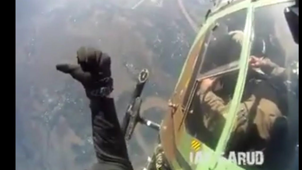 IAF Garud Commandos Para jump from ALH Dhruv helicopter of Indian Air Force.