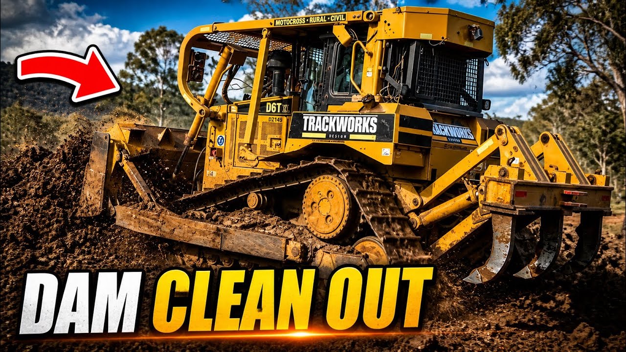 CAT D6 Bulldozer Working Pushing Out a Dam Bank and De-Silting