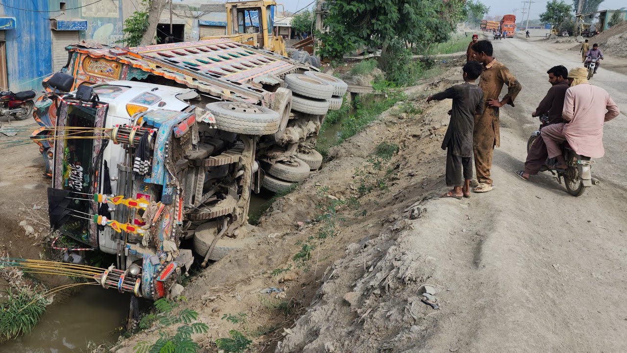 UNBELIEVABLE RECOVERY! 🏗️ Massive Dump Truck Rescued from Deep Canal after Brake Failure!