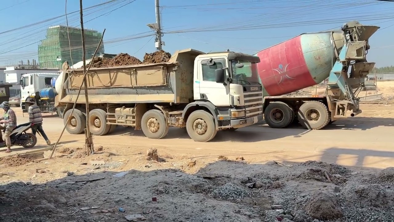 Cement truck pouring concrete