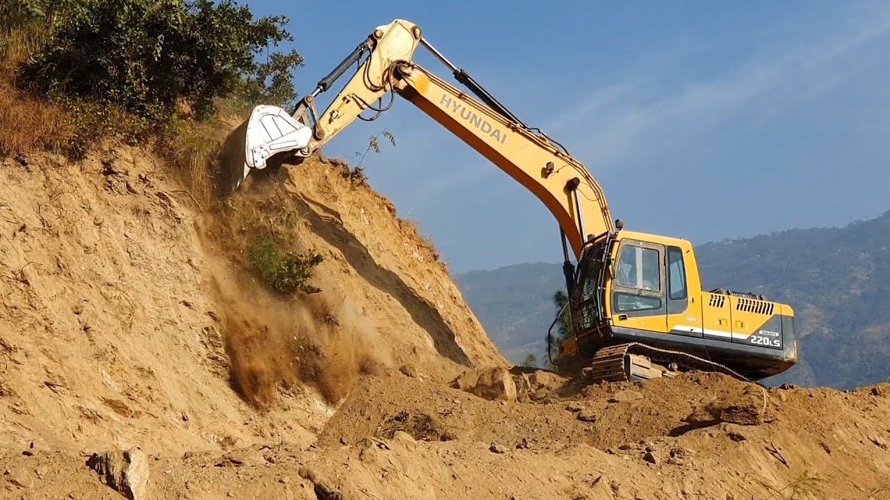 Experienced Excavator Operator Cutting Hill - Hilly Road Construction - Hyundai 220 Excavator