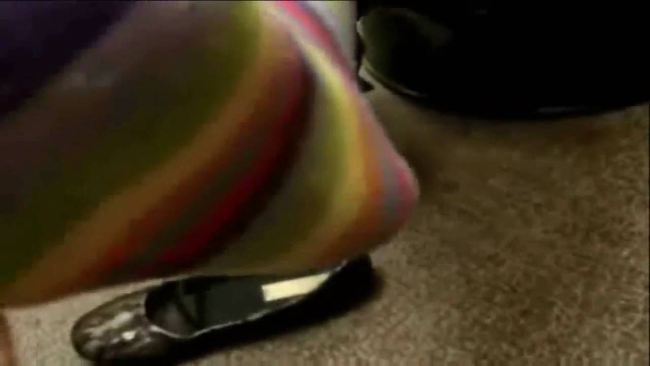 sexy sock fetish shoe dangling in cute rainbow stripped cotton socks