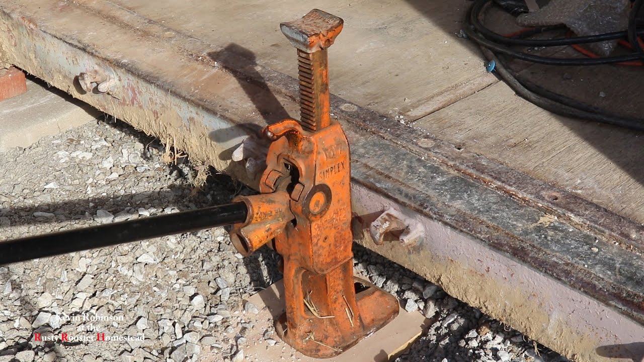 railroad track jack to lift a shipping container