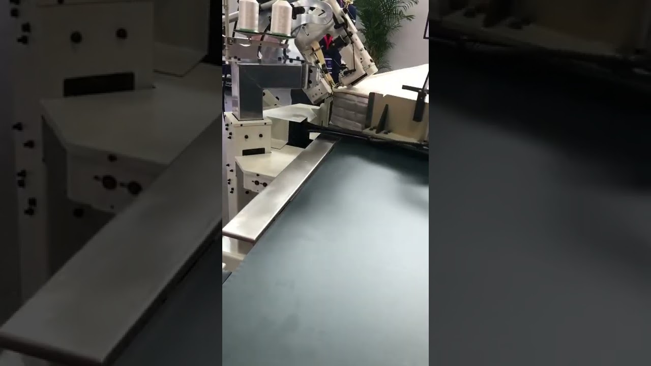 Mattress tape edge sewing machine