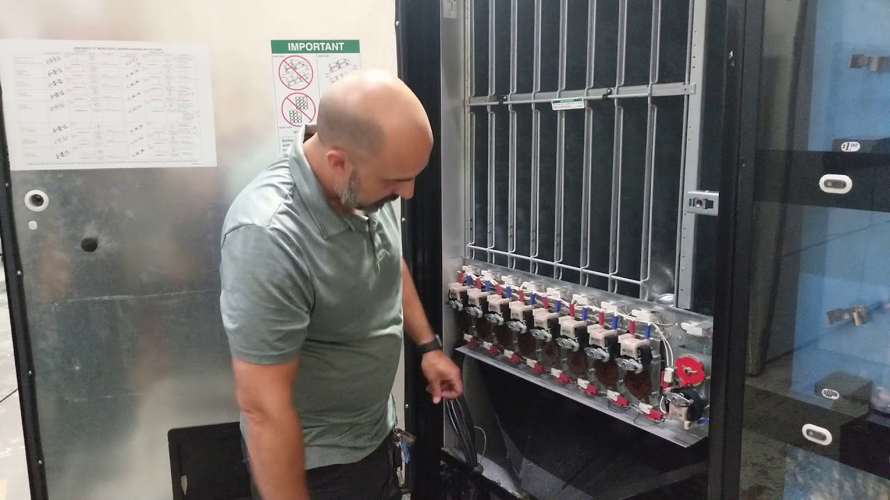 Changing side shim for Dixie Narco 501E soda vending machine.  Make sure machine is unplugged.