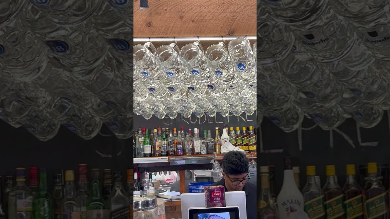 Rows of gleaming beer glasses neatly arranged 