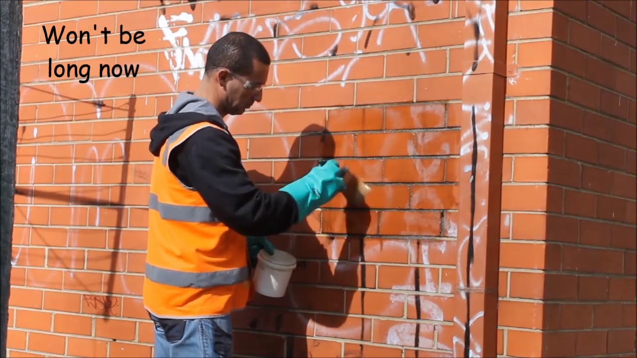 Removal of old sunbaked graffiti from Brick